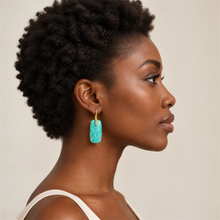 Load image into Gallery viewer, Black model wearing amazonite earrings on a light grey background