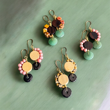Load image into Gallery viewer, Set of colorful earrings on a green surface