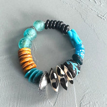 Load image into Gallery viewer, Teal multicolored African beaded bracelet on a light gray background