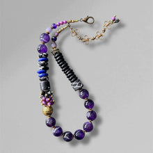 Load image into Gallery viewer, Beaded statement necklace with purple and black beads on a grey 
background