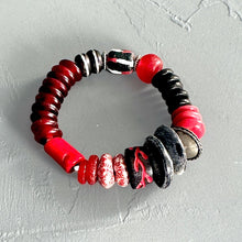 Load image into Gallery viewer, African bracelet with red, black, and silver beads on a light gray background