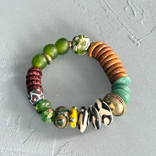Load image into Gallery viewer, Hunter Green African multicolored beaded bracelet on a gray background