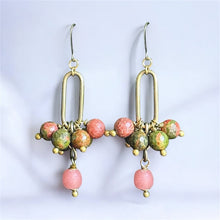 Load image into Gallery viewer, Pair of earrings with pink and green beads on a light gray background