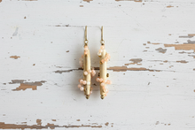 Load image into Gallery viewer, Pair of pearl earrings on a rustic wooden surface