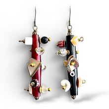 Load image into Gallery viewer, Pair of unique earrings with red, black, and gold elements on a white background