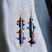 Load image into Gallery viewer, Colorful beaded earrings on a gray background