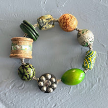 Load image into Gallery viewer, Green colorful beaded bracelet on a textured light gray background