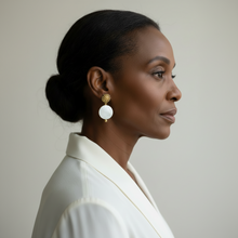 Load image into Gallery viewer, Woman wearing a white outfit with gold earrings against a neutral background