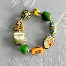Load image into Gallery viewer, Colorful beaded bracelet on a light gray background