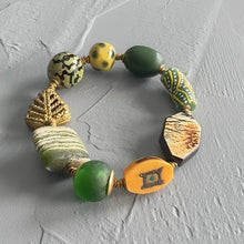 Load image into Gallery viewer, Multicolored beaded bracelet on a gray surface