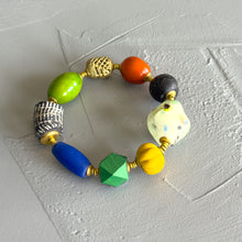Load image into Gallery viewer, Colorful beaded bracelet on a textured white surface