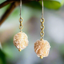 Load image into Gallery viewer, Gold earrings with natural stone beads against a blurred green background