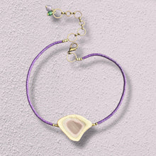 Load image into Gallery viewer, Necklace with tiny purple vinyl beads, an adjustable brass closure and a one of kind imperial jasper pendant in soft lavender, tan, cream, and pale green on a textured lavender background.