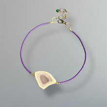 Load image into Gallery viewer, Necklace with tiny purple vinyl beads, an adjustable brass closure and a one of kind imperial jasper pendant in soft lavender, tan, cream, and pale green on a gray background.