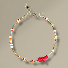 Load image into Gallery viewer, Beaded necklace with brass accents and colorful beads on a beige background