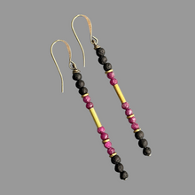 Load image into Gallery viewer, Pair of ruby beaded earrings with gold, black lava stones on a gray background