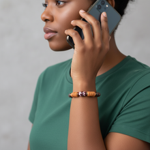 Load image into Gallery viewer, Person wearing a green shirt and a bracelet, holding a phone to their ear against a neutral background