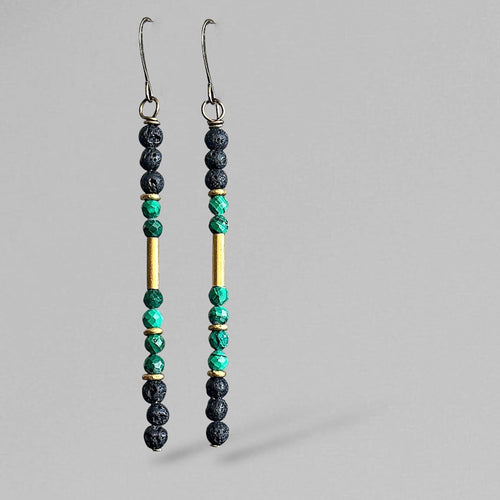 Pair of malachite matchstick beaded earrings on a gray background