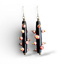 Load image into Gallery viewer, Black earrings with pink pearl and brass beads on a white background