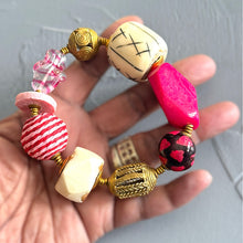Load image into Gallery viewer, Pink &amp; white beaded bracelet on a hand with a neutral background