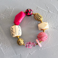 Load image into Gallery viewer, pink and cream beaded bracelet on a textured gray surface