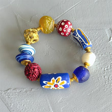 Load image into Gallery viewer, Colorful beaded bracelet on a light gray background
