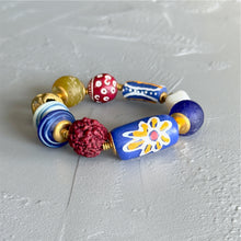Load image into Gallery viewer, Colorful beaded bracelet on a gray surface