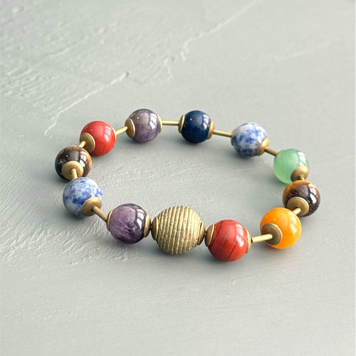 Multicolored beaded bracelet on a light gray surface