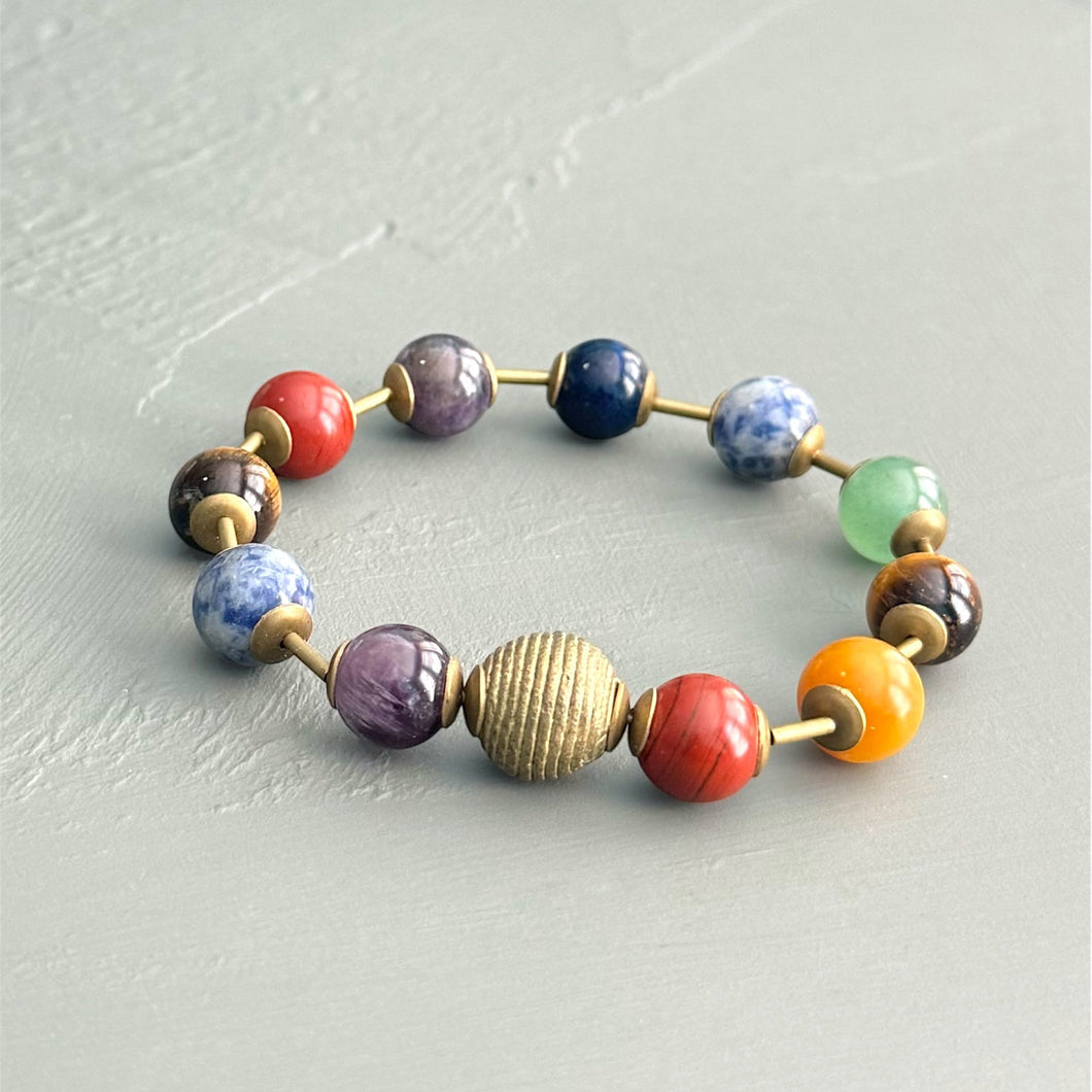 Multicolored beaded bracelet on a light gray surface