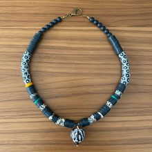 Load image into Gallery viewer, Necklace with black and gray beads on a wooden surface
