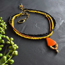 Load image into Gallery viewer, Orange and Yellow Tagua and Suede Multi-strand Necklace