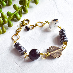 Rutilated Tourmaline and Black African Beaded Charm Bracelet